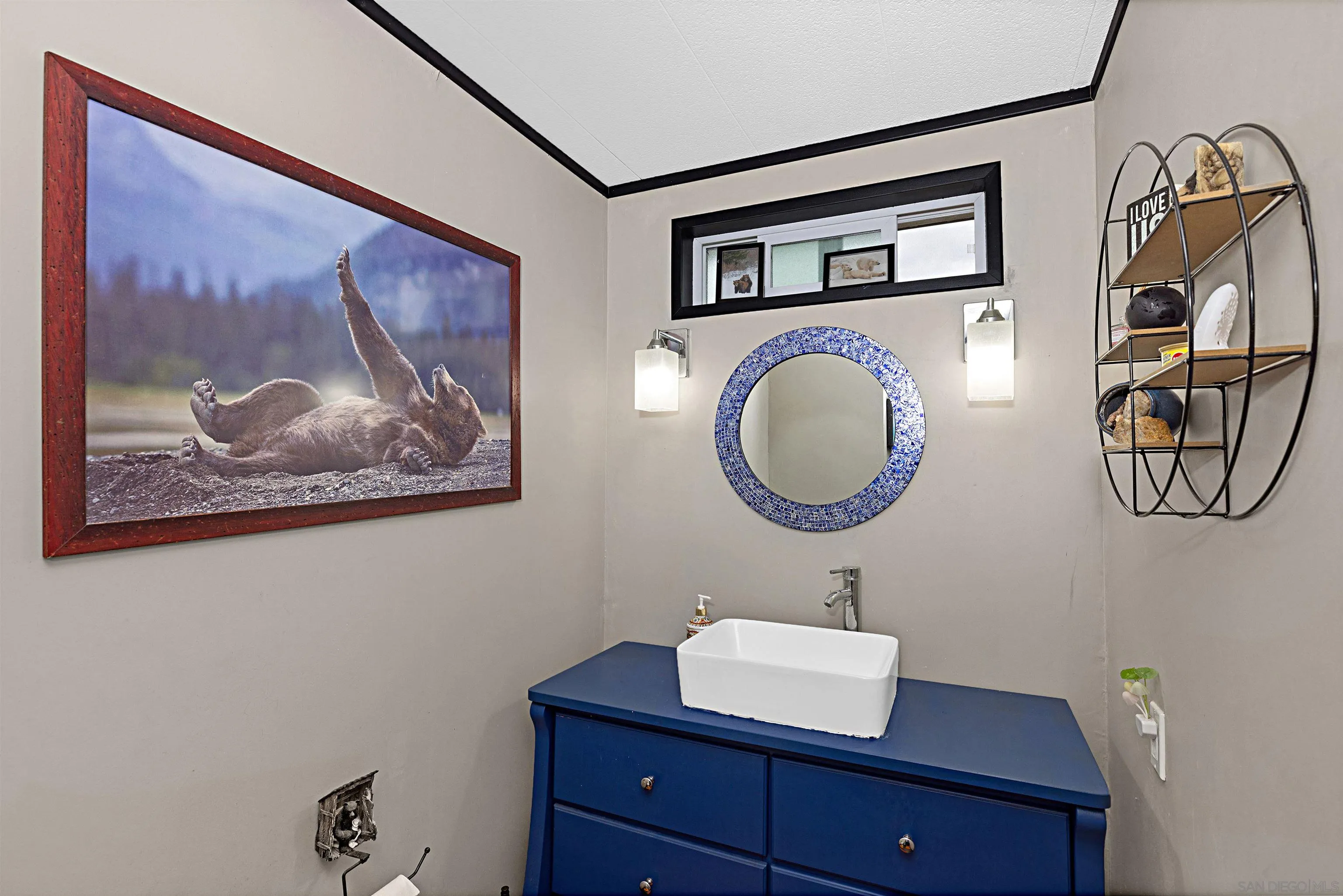 9100 Single Oak Drive, Unit 24 Lakeside, CA 92040 - Photo 22 of 48 a bathroom with a sink mirror and vanity