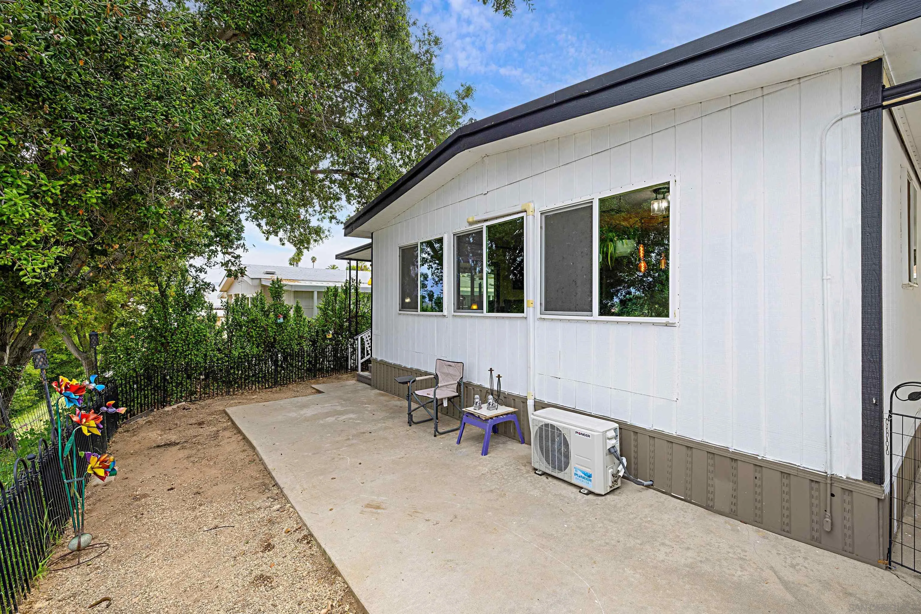 9100 Single Oak Drive, Unit 24 Lakeside, CA 92040 - Photo 26 of 48 a view of a patio with table and chairs and potted plants