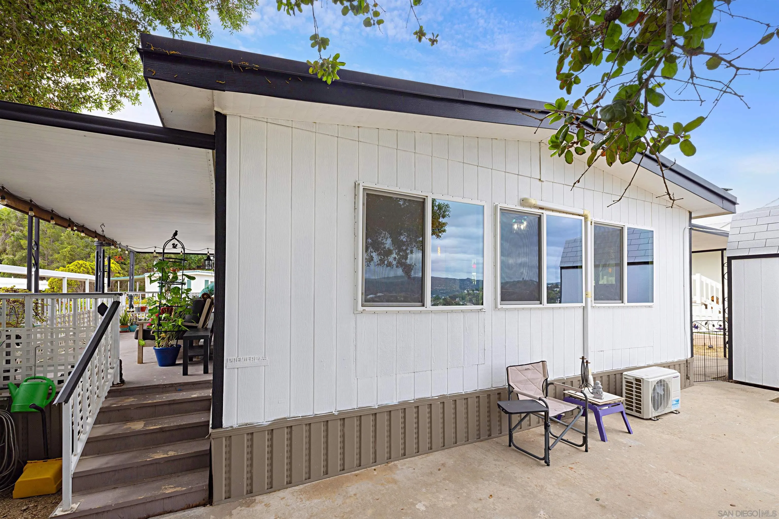9100 Single Oak Drive, Unit 24 Lakeside, CA 92040 - Photo 27 of 48 a view of a house with backyard and sitting area