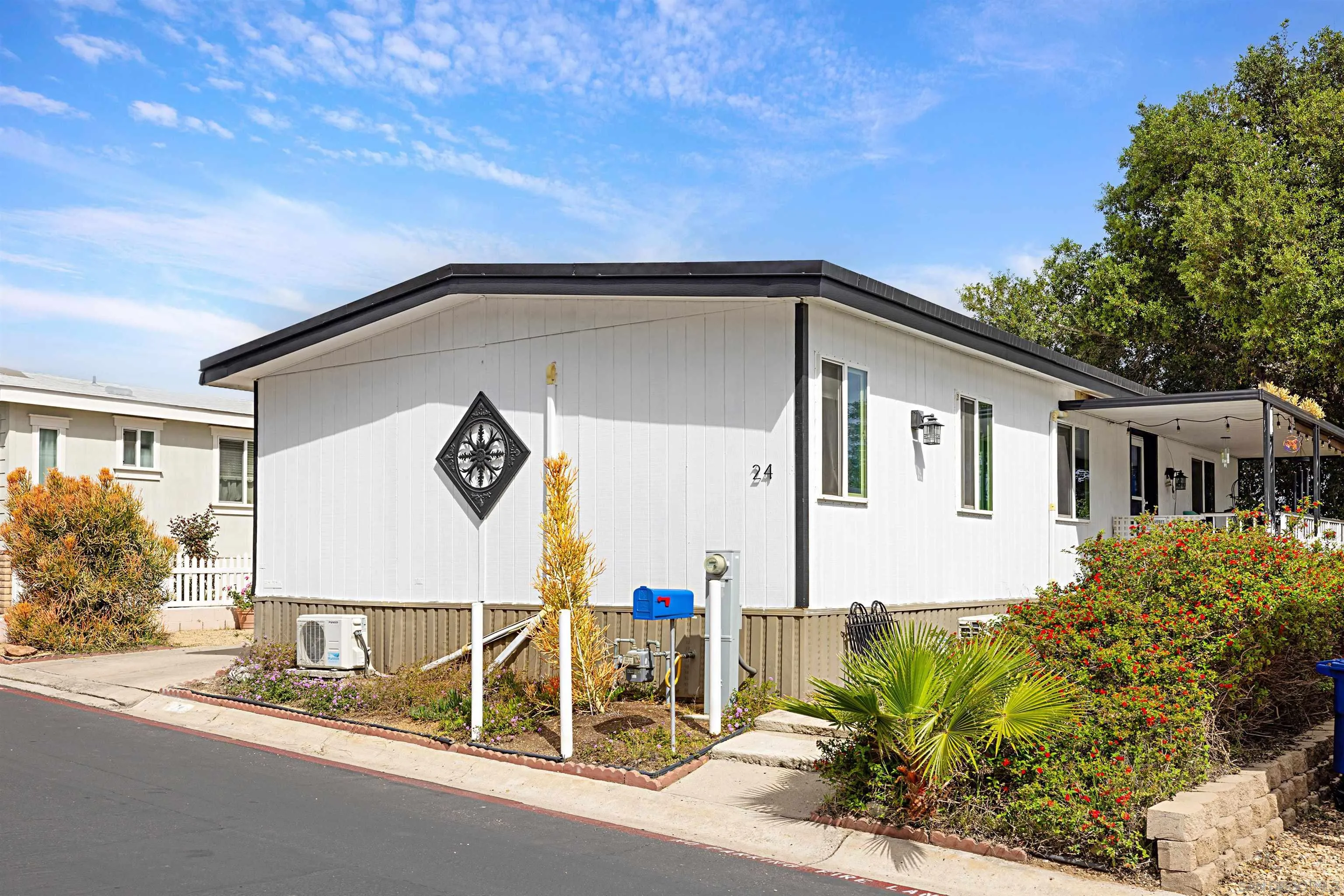 9100 Single Oak Drive, Unit 24 Lakeside, CA 92040 - Photo 3 of 48 a front view of house with yard