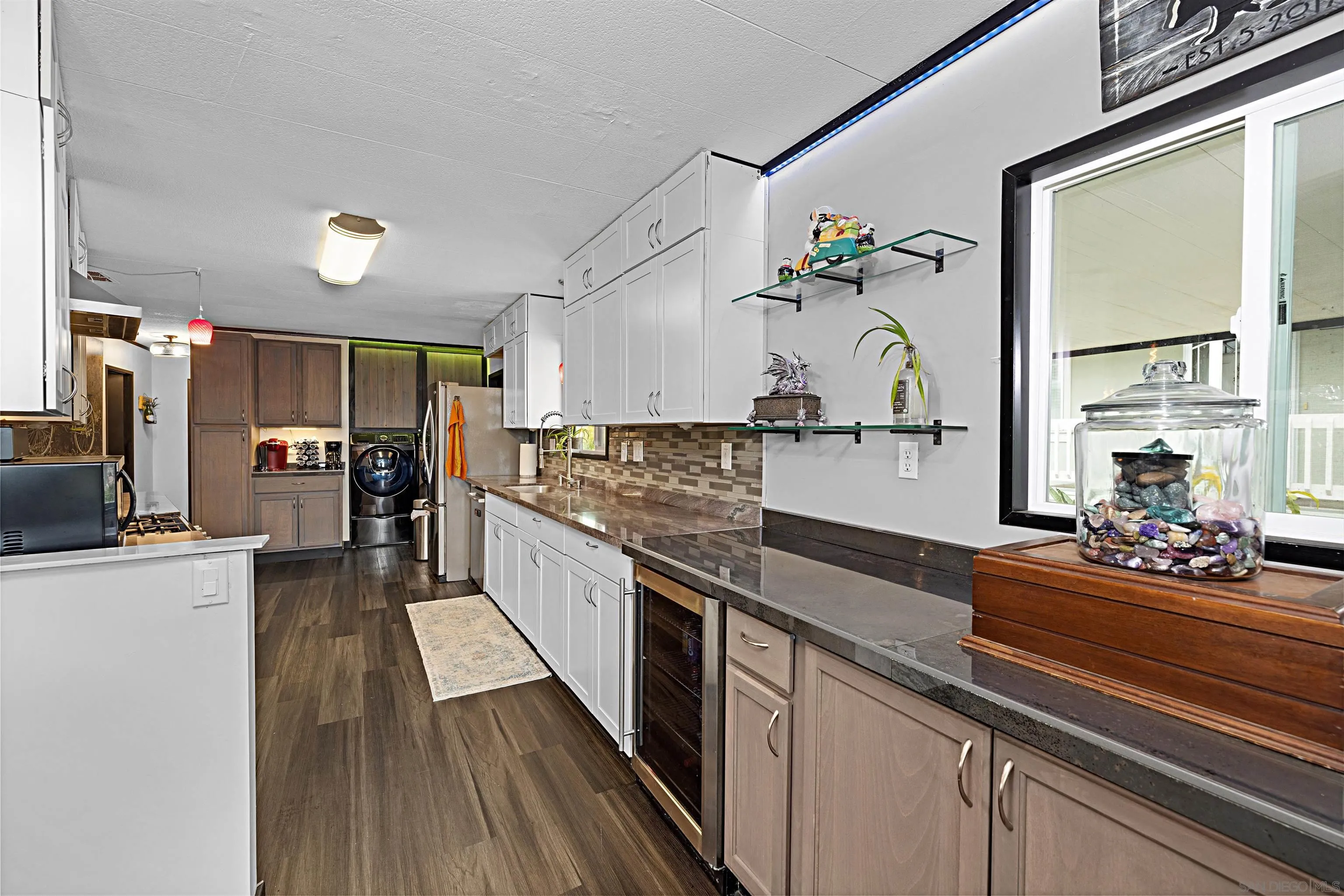 9100 Single Oak Drive, Unit 24 Lakeside, CA 92040 - Photo 5 of 48 a large kitchen with a large counter top appliances and cabinets