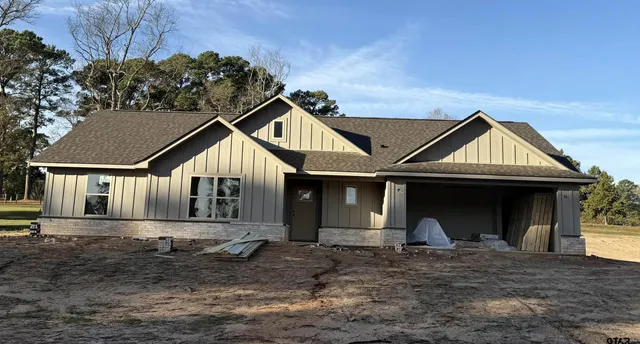 a front view of a house with yard