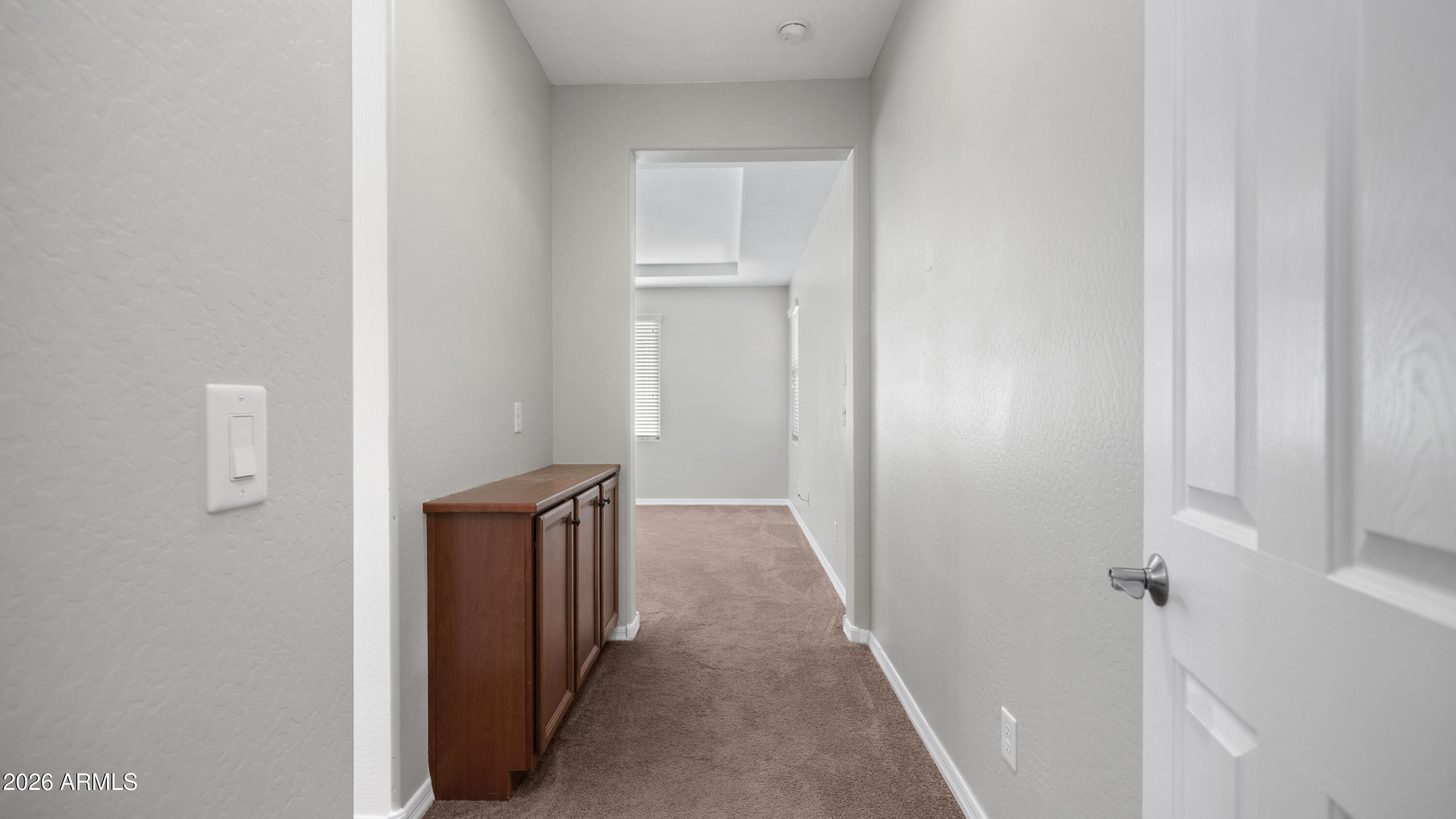 16159 West Granada Road Goodyear, AZ 85395 - Photo 21 of 41 a view of a hallway with wooden floor