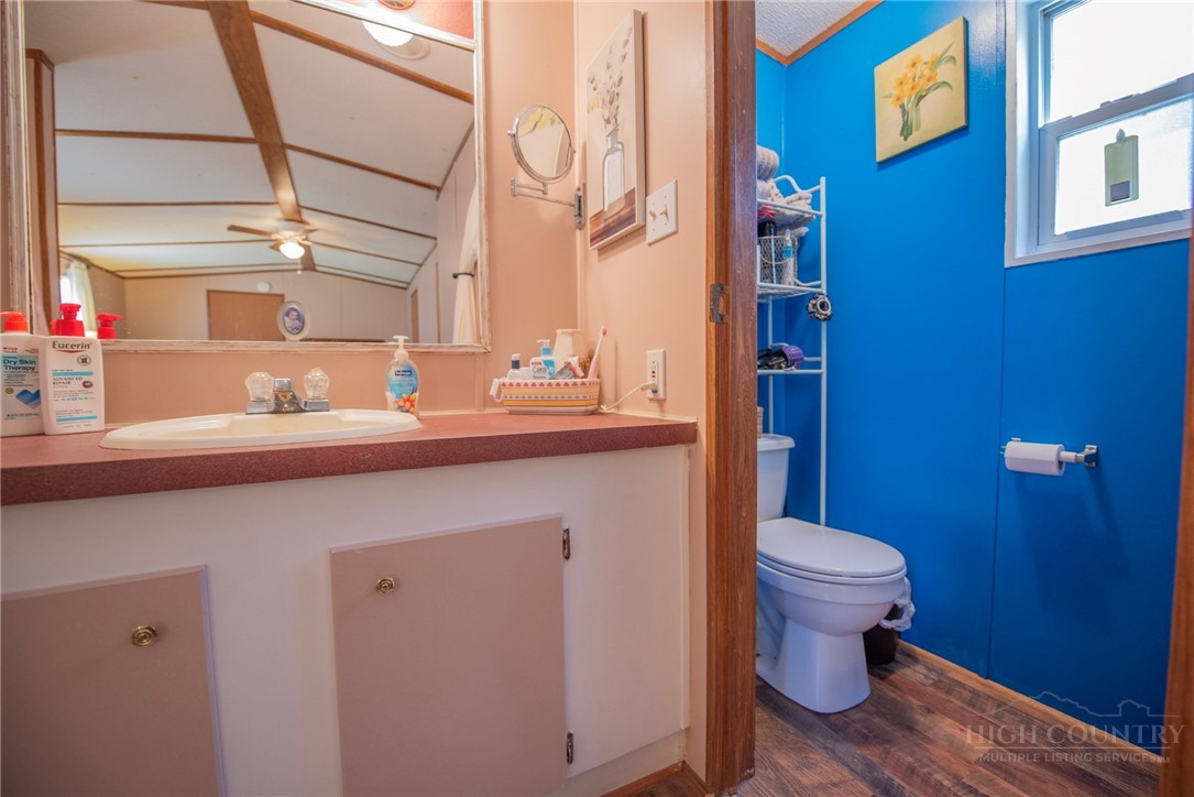 1848 West Mill Creek Road Warrensville, NC 28693 - Photo 35 of 50 a bathroom with a sink and a toilet