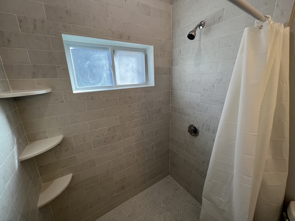 29 Alpine Street, Unit 1 Somerville, MA 02144 - Photo 16 of 33 a bathroom with a shower