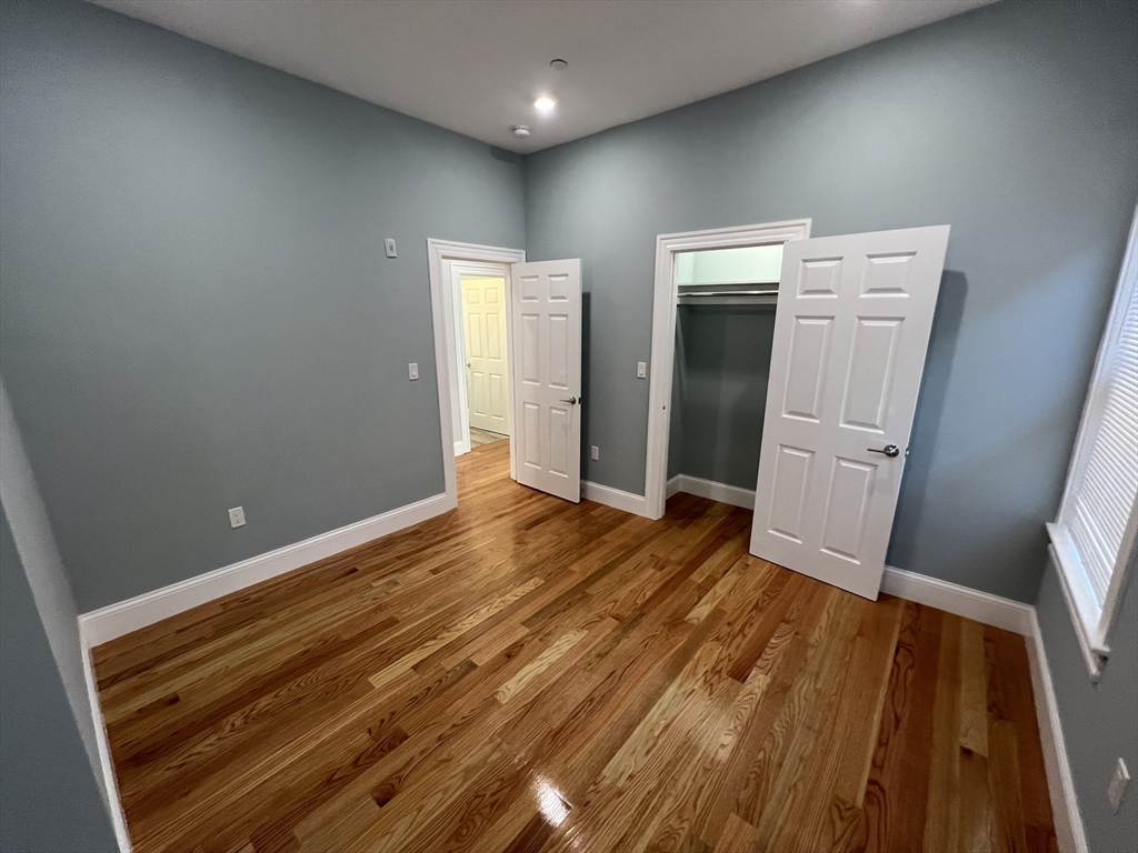 29 Alpine Street, Unit 1 Somerville, MA 02144 - Photo 20 of 33 wooden floor and glass door in a room