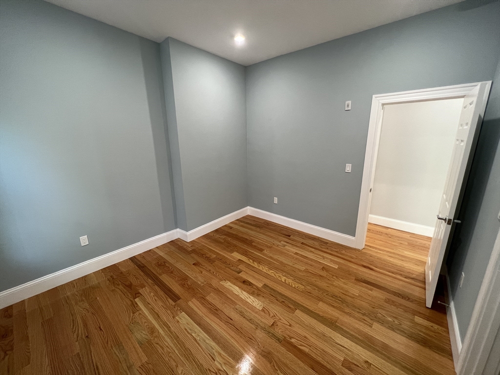 29 Alpine Street, Unit 1 Somerville, MA 02144 - Photo 21 of 33 a view of empty room with wooden floor