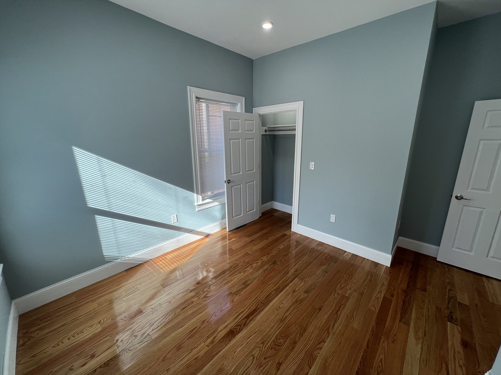 29 Alpine Street, Unit 1 Somerville, MA 02144 - Photo 27 of 33 a view of empty room with wooden floor