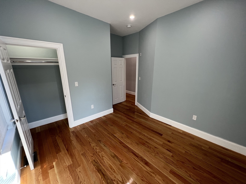 29 Alpine Street, Unit 1 Somerville, MA 02144 - Photo 28 of 33 a view of a room with wooden floor