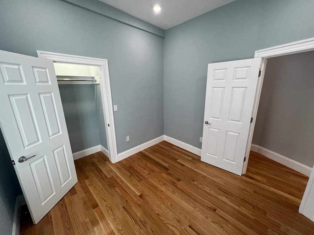 29 Alpine Street, Unit 1 Somerville, MA 02144 - Photo 30 of 33 a view of empty room with wooden floor