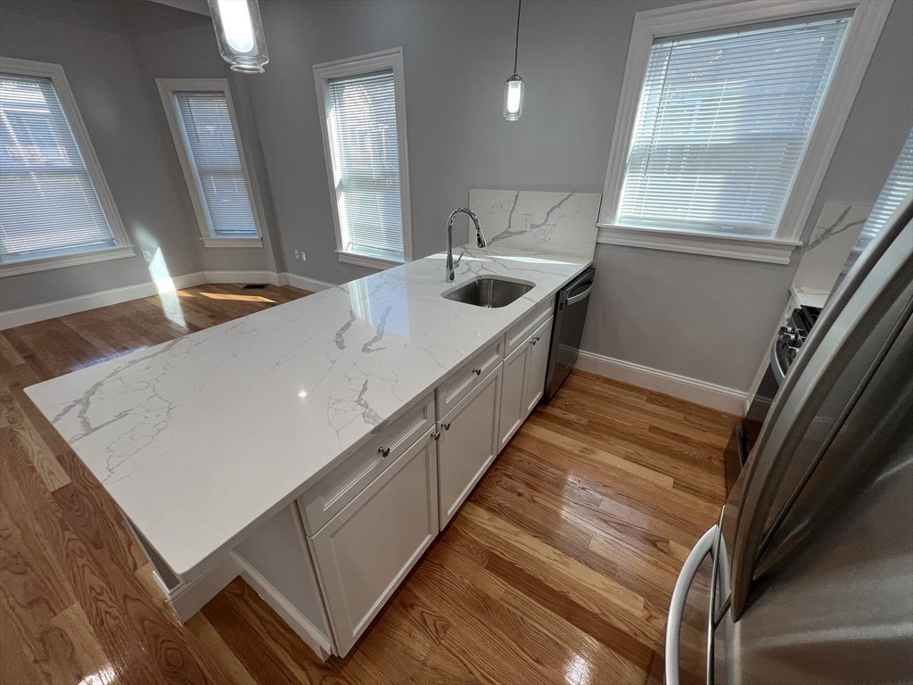 29 Alpine Street, Unit 1 Somerville, MA 02144 - Photo 6 of 33 a kitchen with sink and window