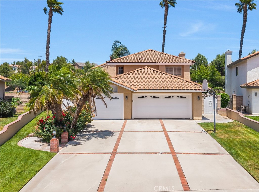 11127 Liverpool Lane Riverside, CA 92503 - Photo 1 of 1 a white building with a yard and potted plants