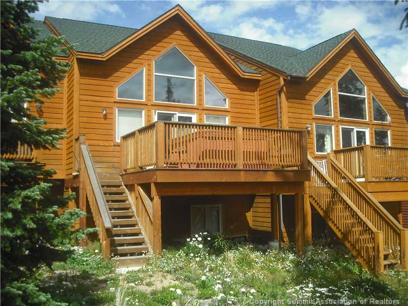 9062 Ryan Gulch Road, Unit B Silverthorne, CO 80498 - Photo 2 of 14 Exterior Back. Large deck, hot tub, walk down to forest service.