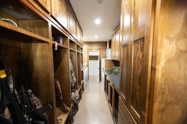 a bathroom with double vanity sink a mirror and a toilet