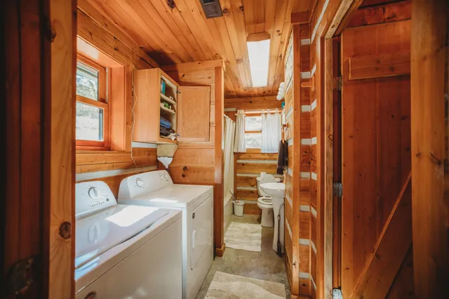 a view of a two chairs in the balcony