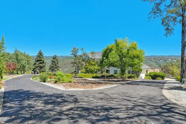 a view of a living room with a large window