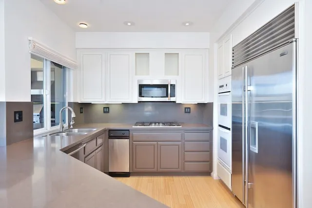 a view of a yard with large trees