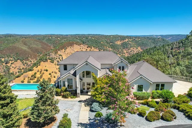 a view of house with yard entertaining space