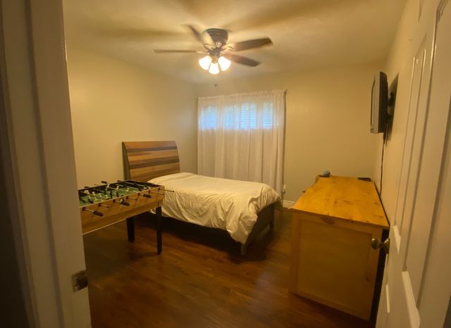 a bedroom with a bed and a table