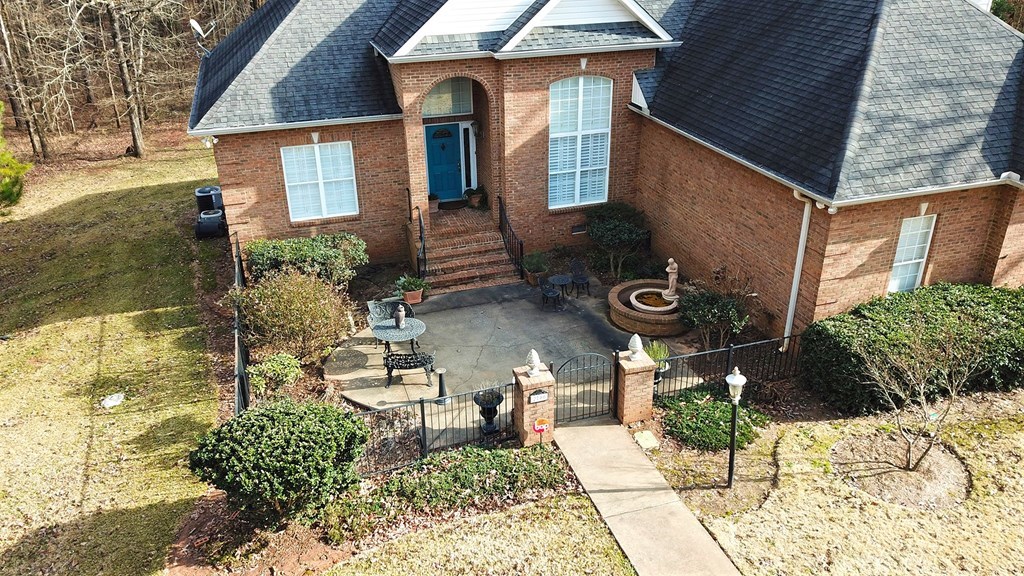 2700 Maynards Mill Road Forsyth, GA 31029 - Photo 3 of 44 a front view of a house with garden