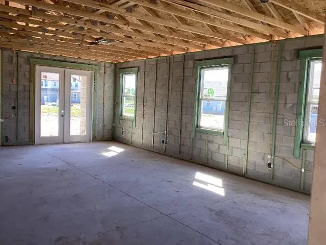 an empty room with windows