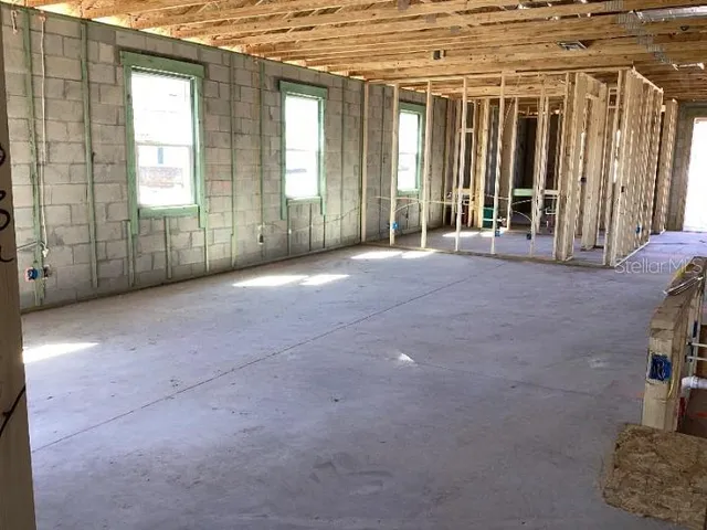 a view of empty room with windows