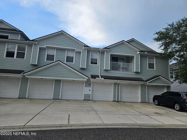 a front view of a house with a garage