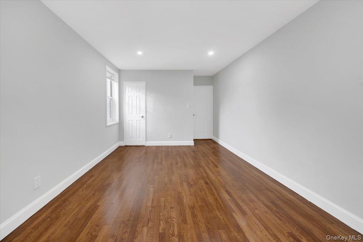 4265 Webster Avenue, Unit 5C Bronx, NY 10470 - Photo 13 of 21 a view of empty room with wooden floor
