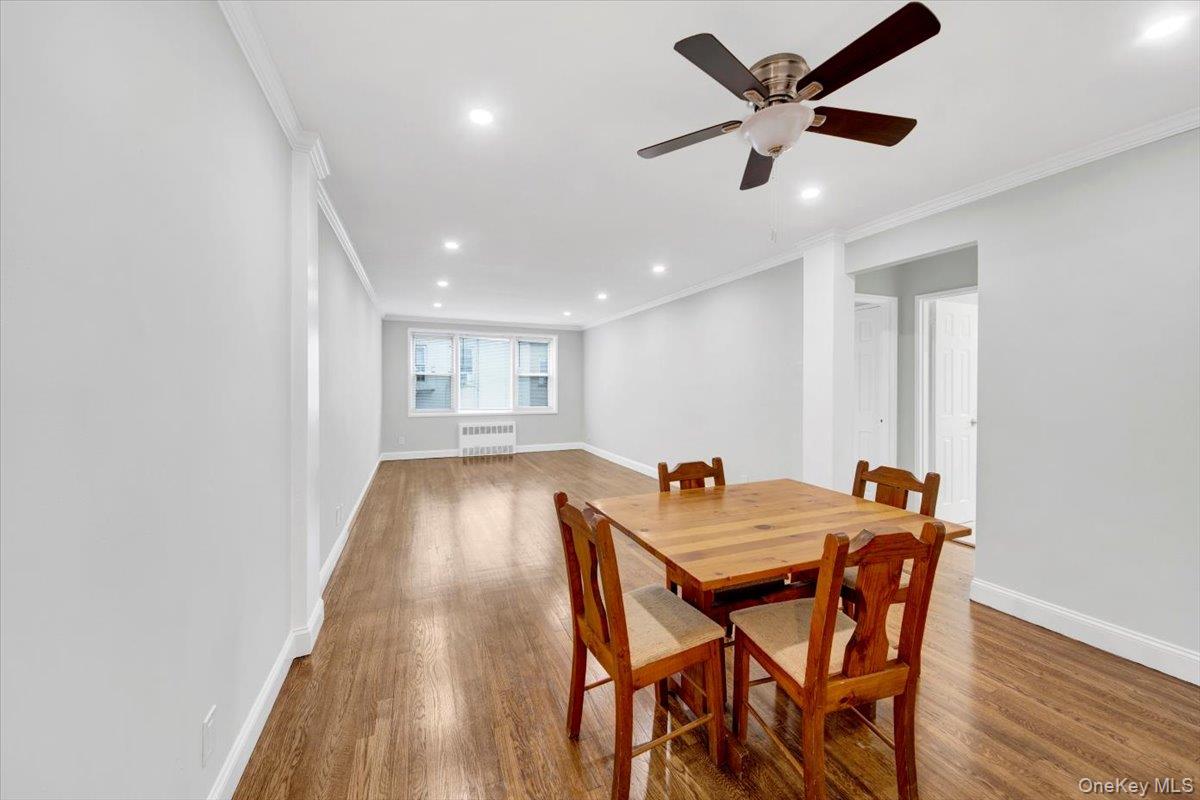 4265 Webster Avenue, Unit 5C Bronx, NY 10470 - Photo 8 of 21 a view of a dining room with furniture and a ceiling fan