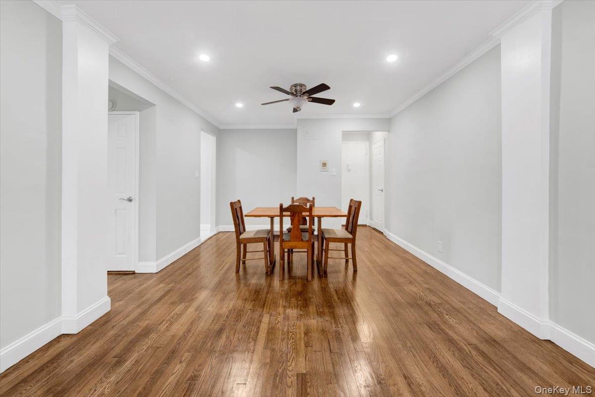 4265 Webster Avenue, Unit 5C Bronx, NY 10470 - Photo 9 of 21 a view of a dining room with furniture and wooden floor