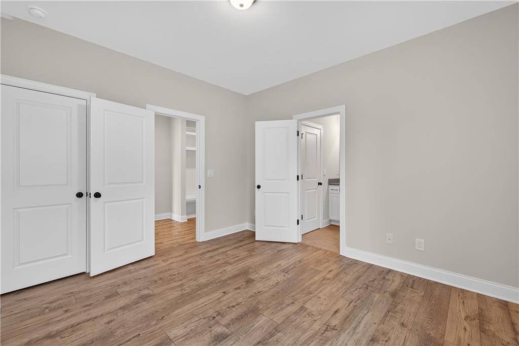 3787 Cheyenne Lane Jefferson, GA 30549 - Photo 24 of 82 a view of an empty room with wooden floor