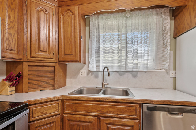 553 North 200 West Bountiful, UT 84010 - Photo 9 of 26 Kitchen featuring light countertops, stainless steel appliances, and wood finish cabinetry
