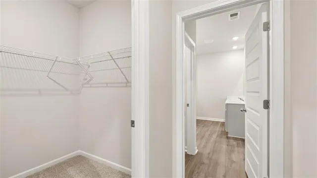 a view of a bathroom from a hallway