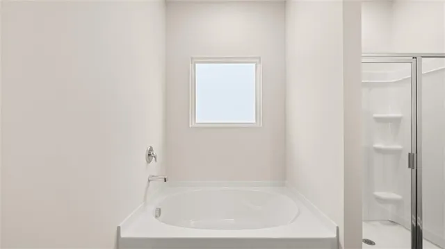 a white bath tub sitting next to a white sink