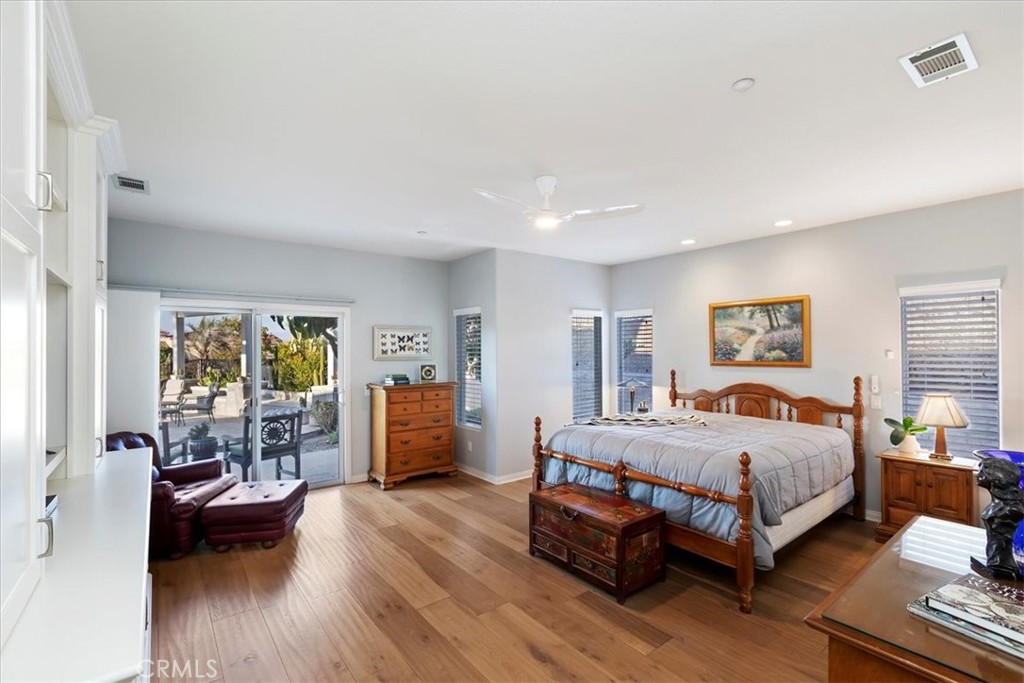 1260 Ransom Road Riverside, CA 92506 - Photo 19 of 50 a bedroom with a bed and wooden floor