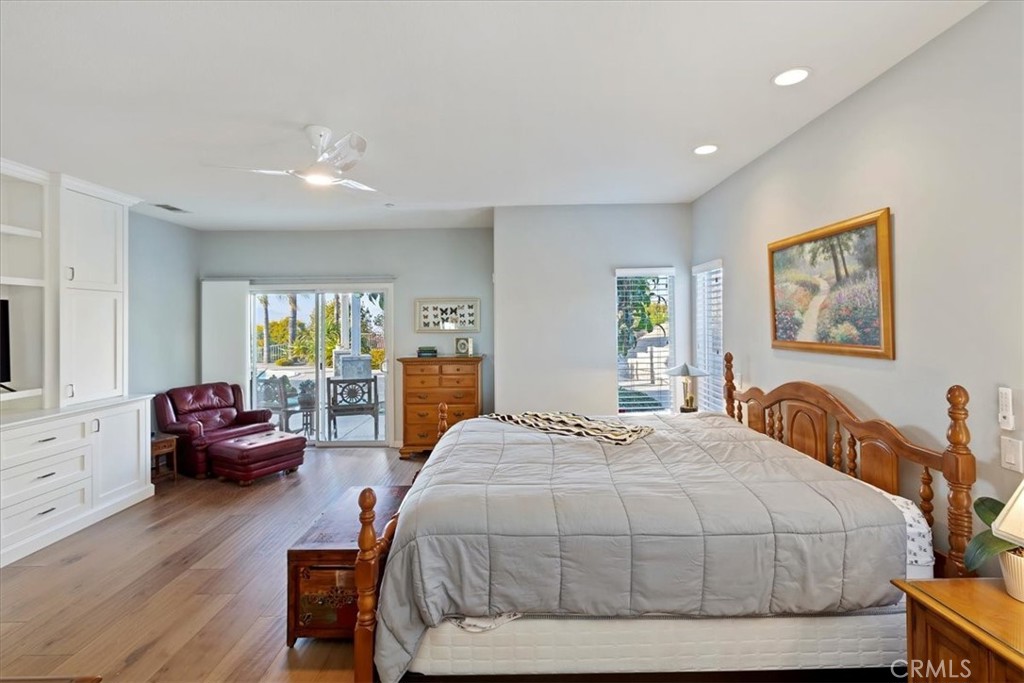 1260 Ransom Road Riverside, CA 92506 - Photo 20 of 50 a spacious bedroom with a bed a couch and dresser