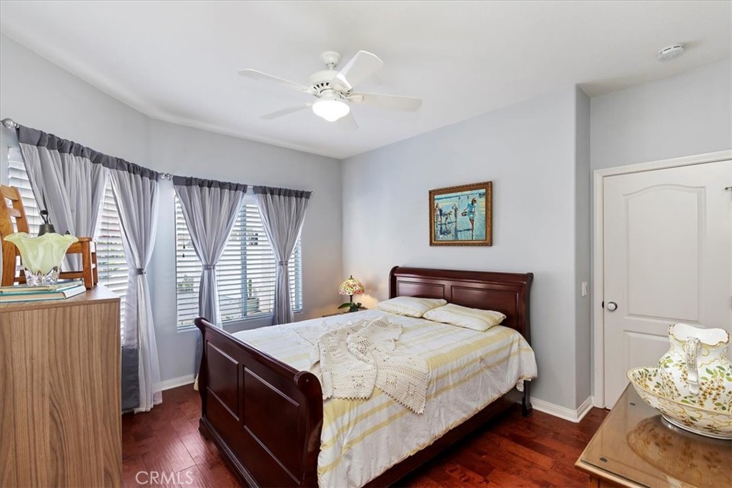 1260 Ransom Road Riverside, CA 92506 - Photo 24 of 50 a bedroom with a bed and wooden floor