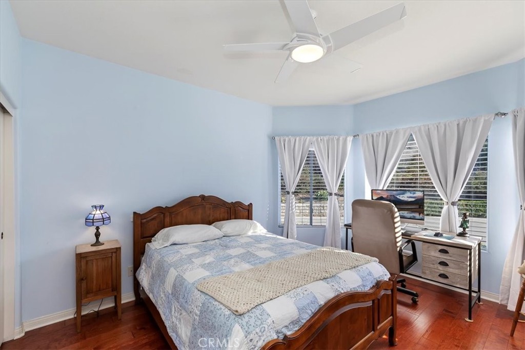 1260 Ransom Road Riverside, CA 92506 - Photo 26 of 50 a bedroom with a bed and a table