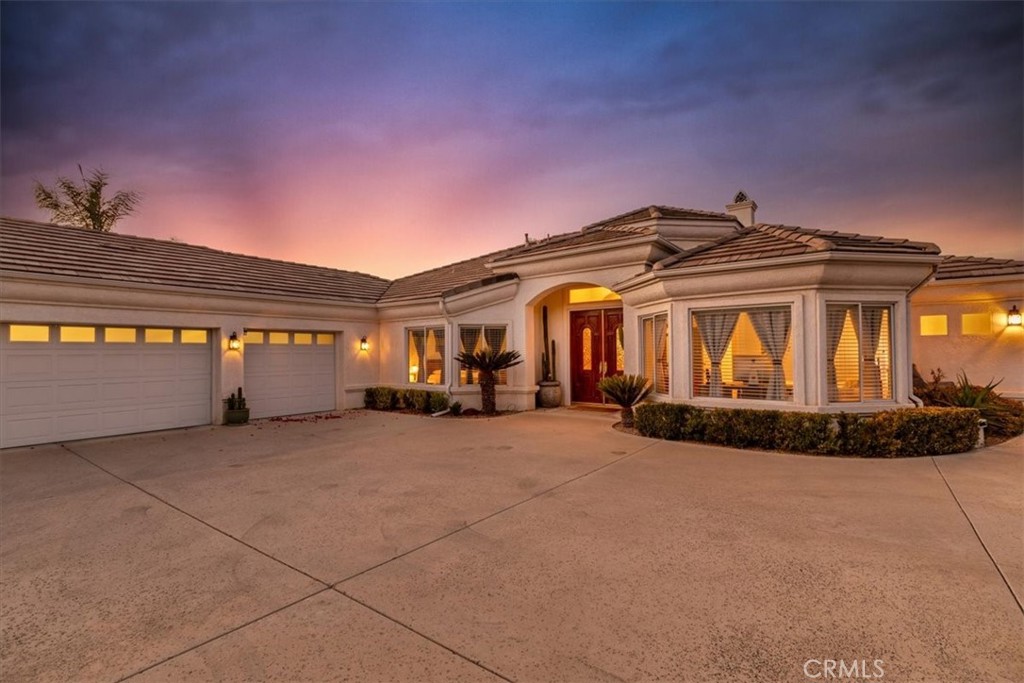 1260 Ransom Road Riverside, CA 92506 - Photo 40 of 50 a view of a house with basket ball court and a front door