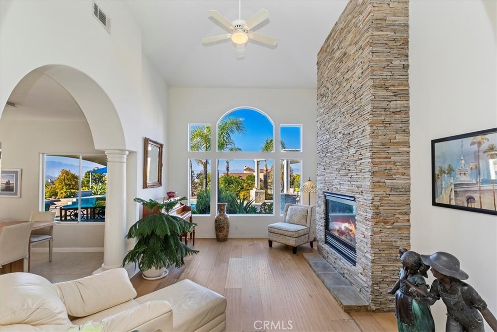 1260 Ransom Road Riverside, CA 92506 - Photo 7 of 50 a living room with furniture a fireplace and a chandelier