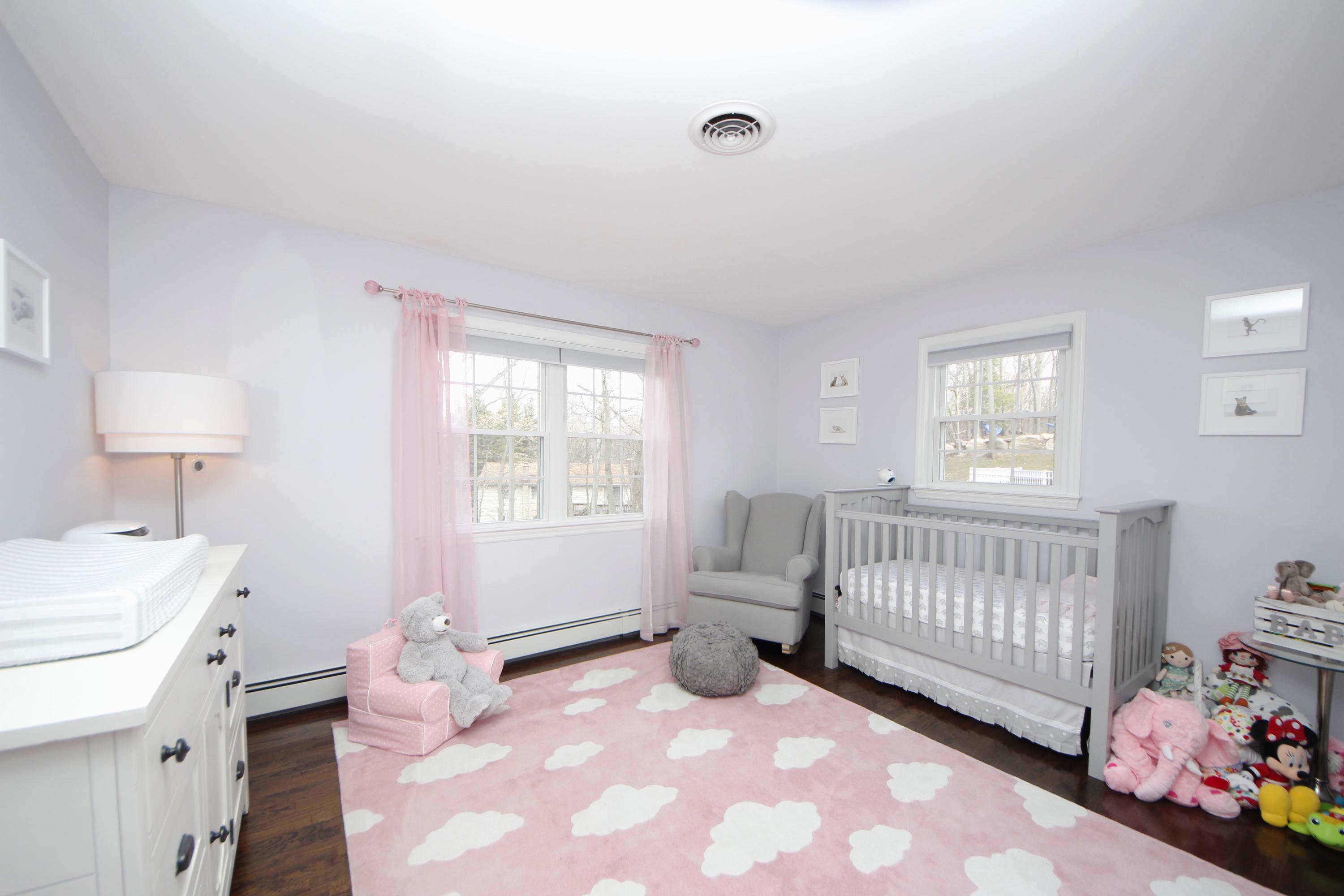 27 Thomes Street Rowayton, CT 06853 - Photo 12 of 19 a view of a bedroom with baby crib and a window