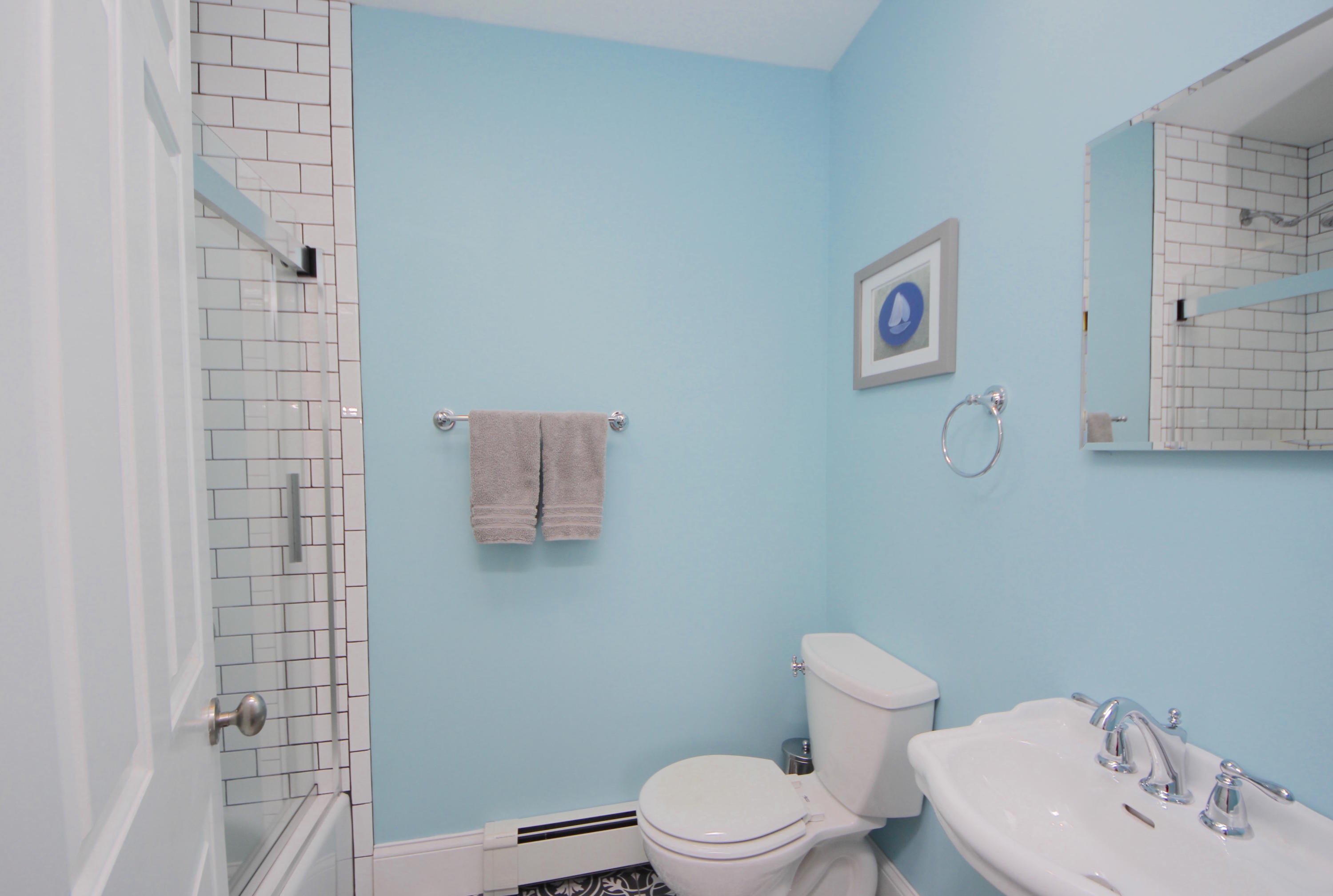 27 Thomes Street Rowayton, CT 06853 - Photo 15 of 19 a white toilet sitting next to a bathroom sink