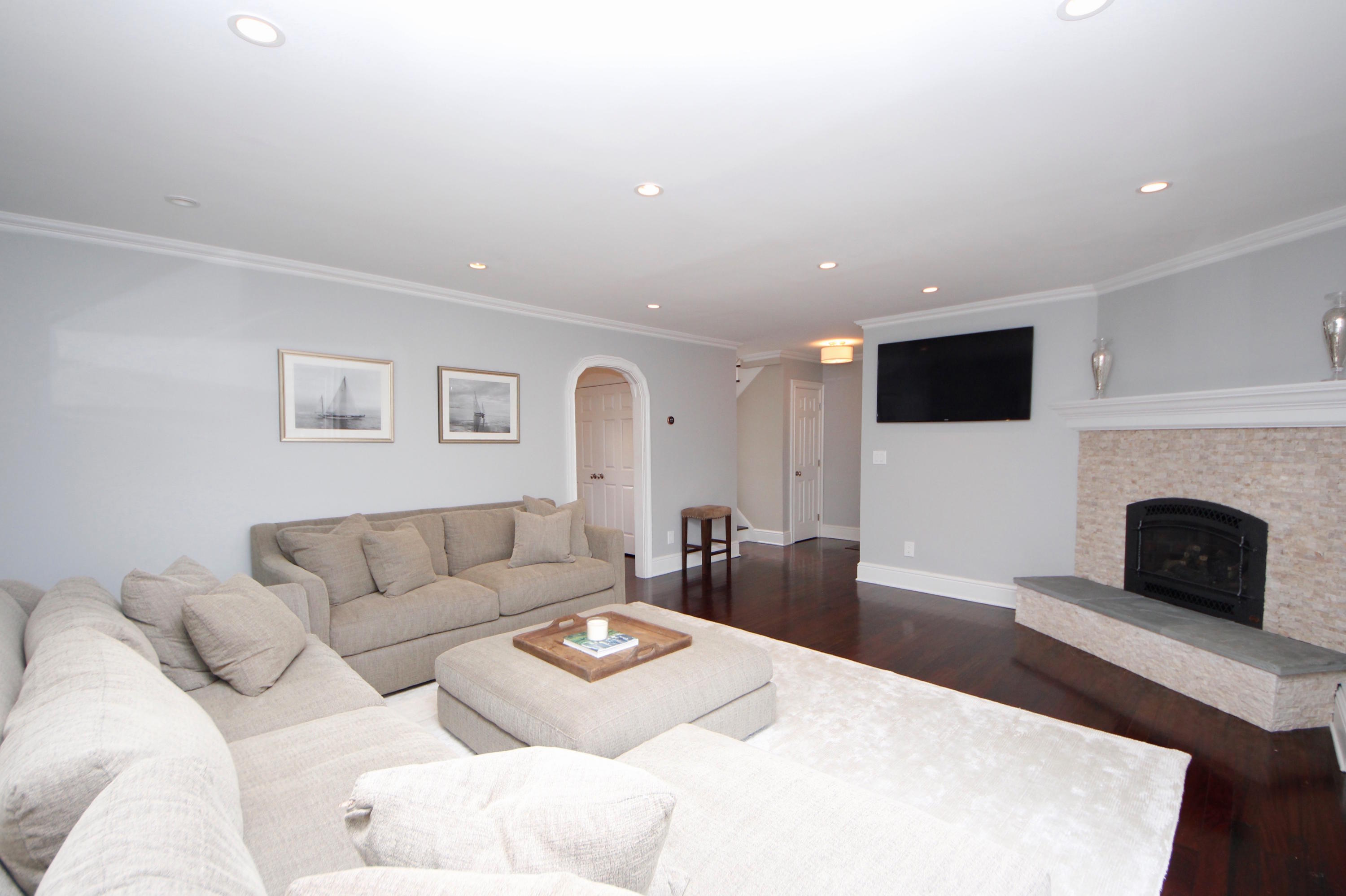 27 Thomes Street Rowayton, CT 06853 - Photo 4 of 19 a living room with furniture and a fireplace