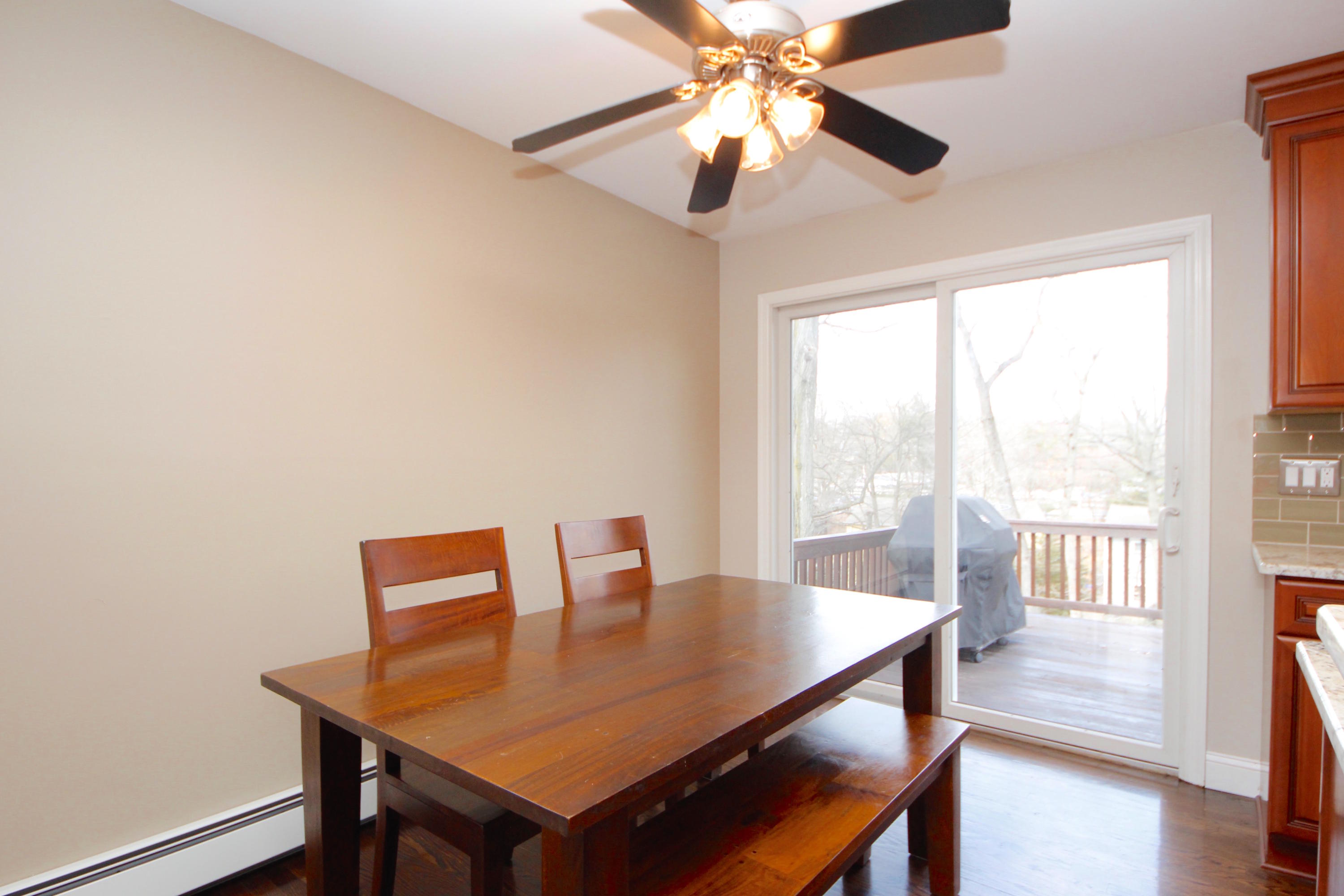 27 Thomes Street Rowayton, CT 06853 - Photo 7 of 19 a view of a dining room with furniture window and wooden floor