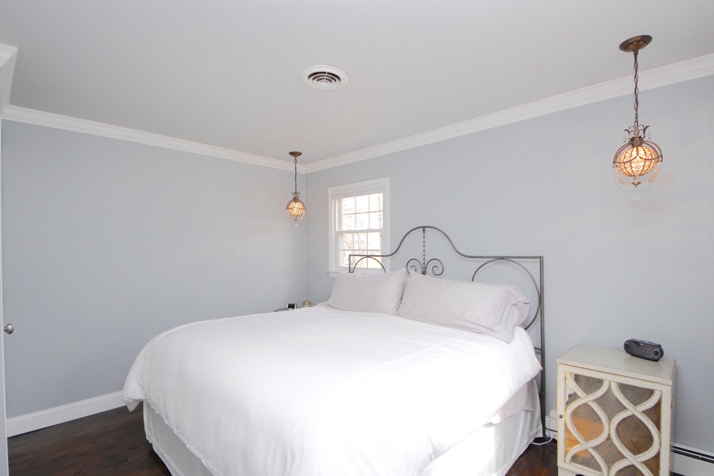 27 Thomes Street Rowayton, CT 06853 - Photo 9 of 19 a bedroom with a bed and a window