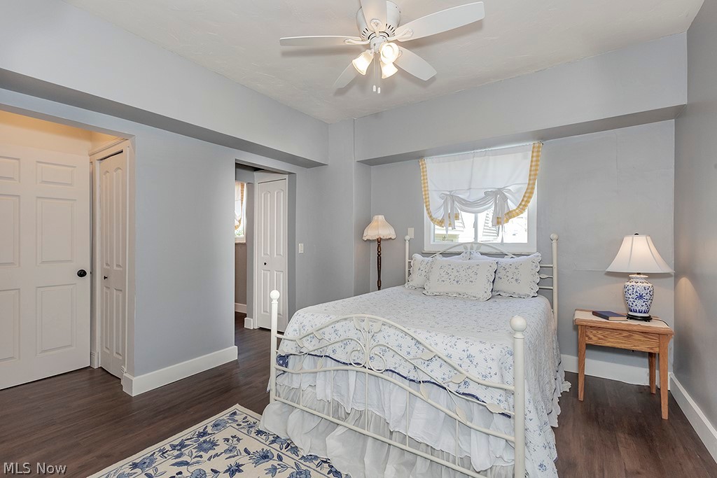 3090 Warren Road Cleveland, OH 44111 - Photo 17 of 50 Bedroom featuring dark hardwood / wood-style floors, a closet, and ceiling fan