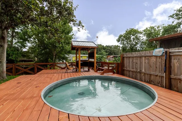 a living room with furniture a flat screen tv and a couch