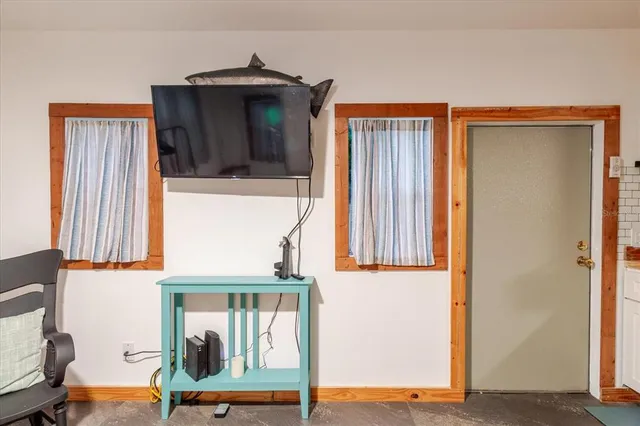 a kitchen with a refrigerator and a sink