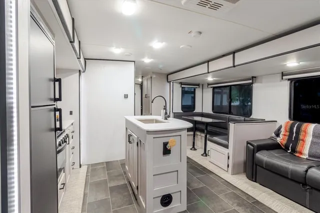 a living room with furniture and a table