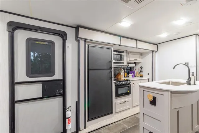 a view of a backyard with sitting area